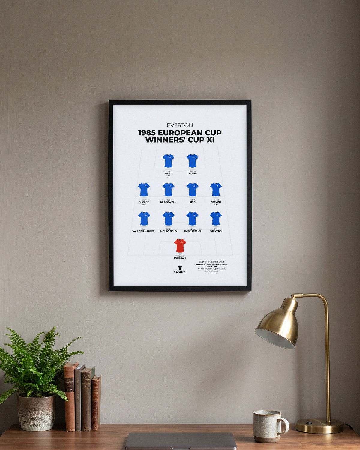 Everton 1985 European Cup Winners' Cup XI framed print, black frame above a desk