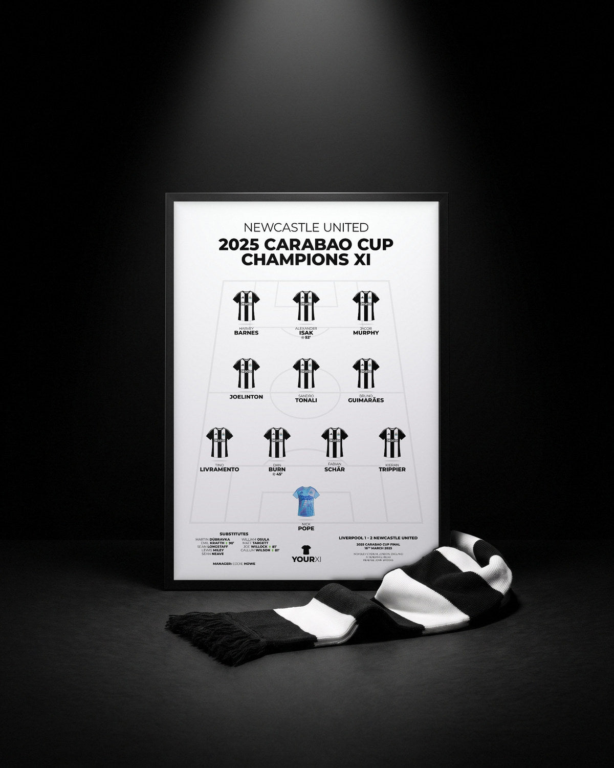 A framed Newcastle XI print with a black and white scarf