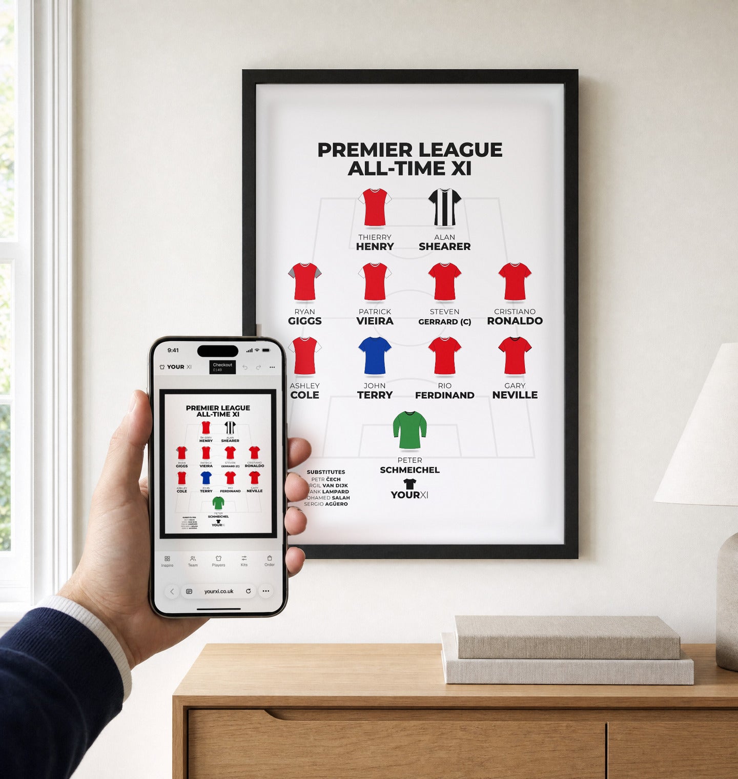 A hand holding a phone with the YourXI builder in front of a framed YourXI print on a wall